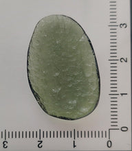 Load image into Gallery viewer, Moldavite cabochon polished/raw sides 3.32gr/16.6ct certificate of authenticity
